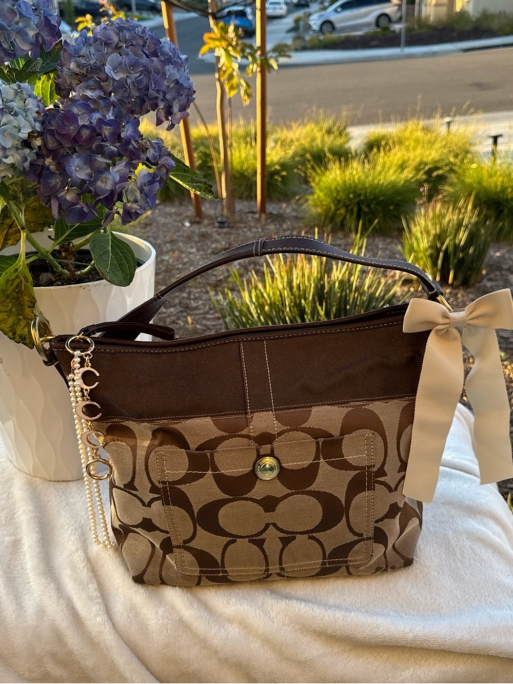 Coach Brown Signature Canvas Shoulder Bag with Cream Bow